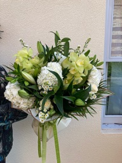 Cool and Classic - Bespoke hand tie bouquet using a selection of flowers in green and white.