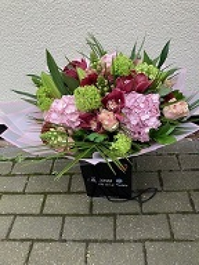 Stylish Day - Hand tie bouquet using a selection of our top quality flowers in shades of pink, green and plum.