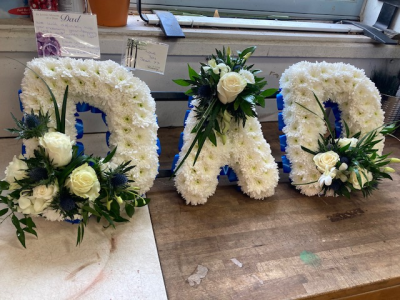 Dad Funeral Tribute. - Floral tribute designed with flowers and foliage, for that special Dad. For any colour change please make notes in the special requirements box.