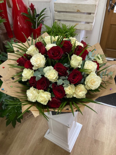 Best of Both - 15 red roses and 15 white roses. Hand tied with complimenting foliage and gift wrapped