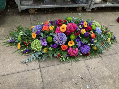 Funeral Spray - Funeral spray in strong vibrant colours and seasonal flowers.