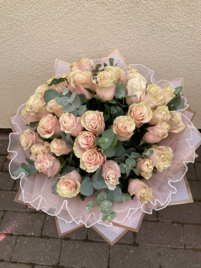 In the Pink - 24 Pink Mondial Roses designed in a hand tied bouquet with complimenting foliage and wrapping. Other colours are available upon request.