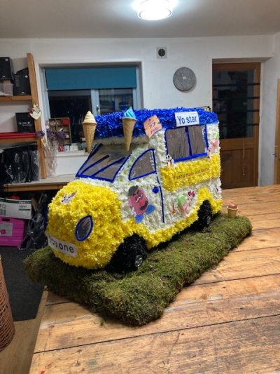 Bespoke floral Designs - Floral interpretation of an ice cream van .