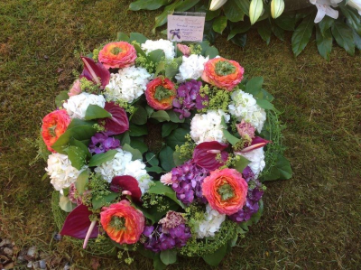 Rustic Wreath Design - Open wreath design with a selection of seasonal flowers.