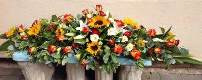 Funeral Spray - Autumn Shaded funeral spray made with seasonal flowers.