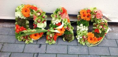 Dad Floral Tribute - Dad floral tribute designed with autumn flowers in a grouped style.