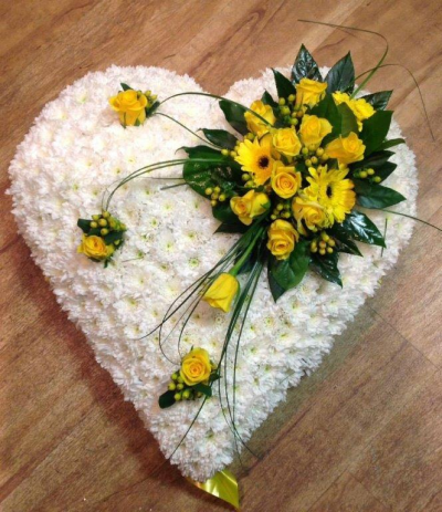 Massed Heart - Massed heart with a yellow rose spray. The colours and flowers can be changed upon request. Simply inform us in the special requests box, when placing the order.