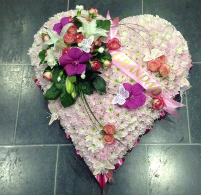 Pastel Massed Heart - Massed in flowers and finished with a rose and orchid mount. Flowers and colours can be changed upon request. Please use the special request box when placing the order, if required