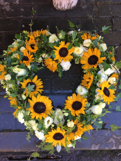 Sunflower Heart Wreath - Open heart wreath in sunflowers and complimenting flowers and foliage.