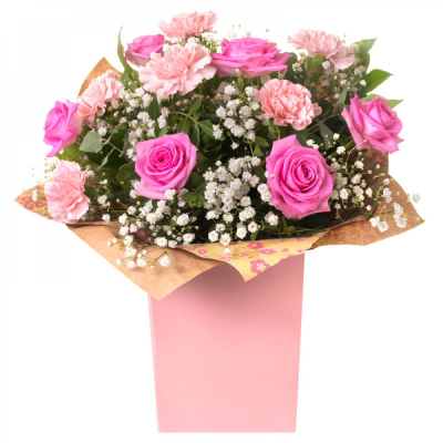 Pink Smooch - 6 pink roses and 6 pink carnations, beautifully hand tied with gyp and foliage.