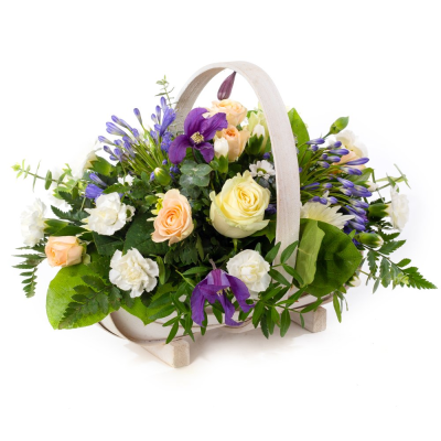 In the Blue Basket - A sweet pastel basket brimming with roses, carnations and seasonal charm. Soft, stylish, and full of love.