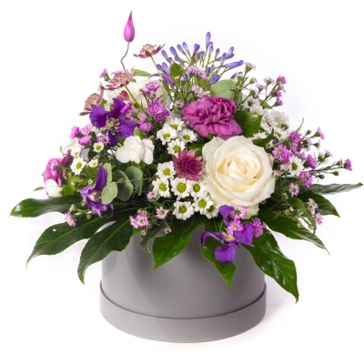 Purple Haze - A jewel-toned beauty with a modern twist. Purple Haze combines soft whites with rich shades of purple and lilac, creating a striking contrast that feels both elegant and uplifting. Presented in a stylish hatbox, it's a chic design full of colour, texture, and charm.