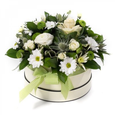 Olivia - A fresh and stylish hat box filled with soft white and cream blooms — a timeless, elegant gesture.