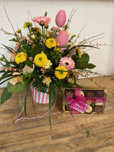 Easter Treat. - An Easter treat for both your eyes and taste buds, this beautiful flower design comes in a decorative box with a handle and is accompanied by a delicious selection of chocolates. Lily Jones Flowers Birmingham will deliver in the city centre and the outskirts as well as Birmingham Jewellery Quarter.
