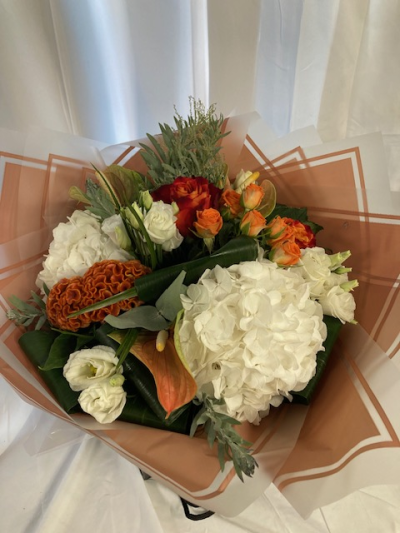 Peaches and Creams - A delicious combination of peach and cream seasonal flowers with complimenting foliage with matching wrapping we can deliver in and around Birmingham City Centre and the Jewellery